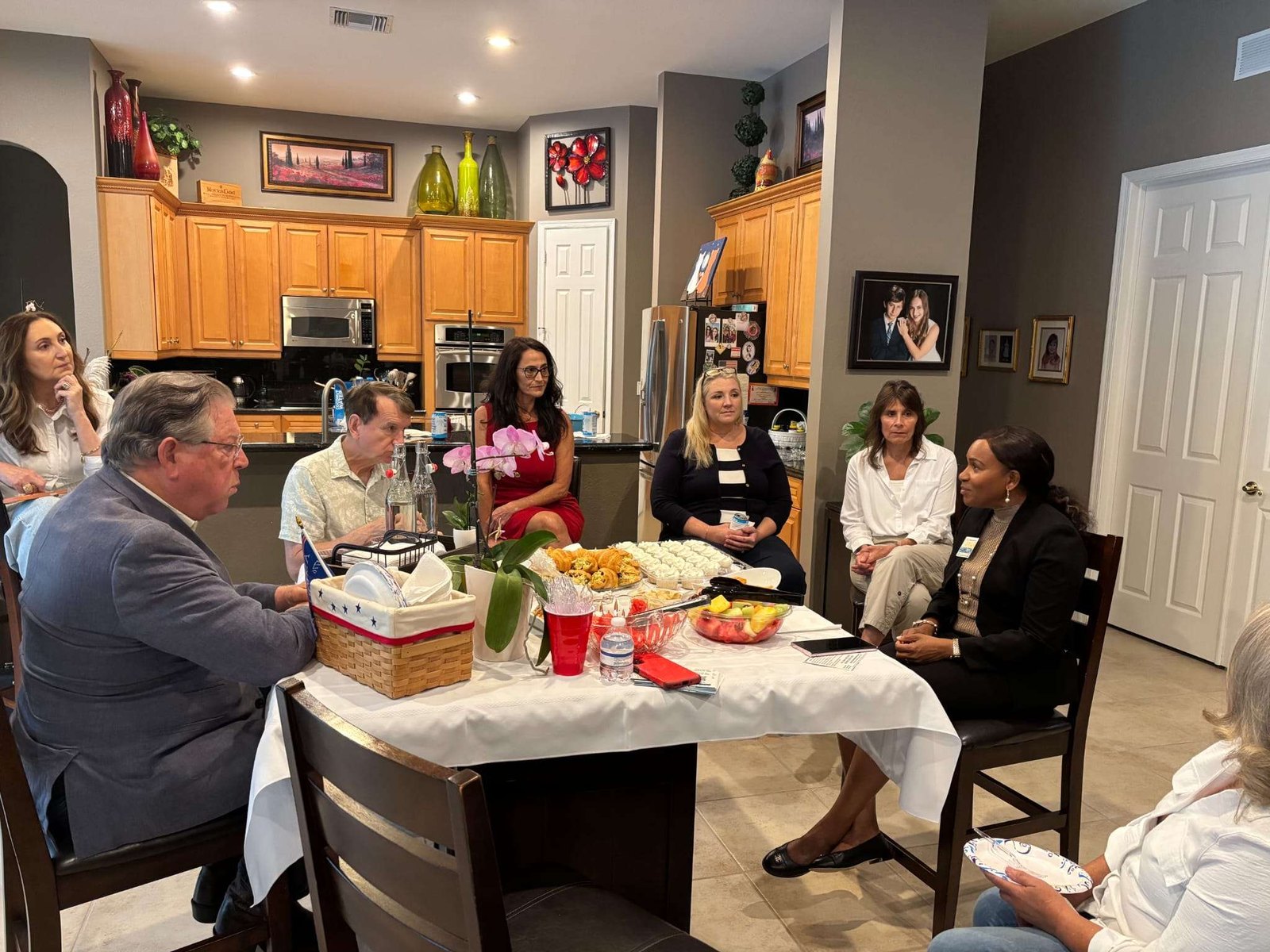 Tamar Hamilton meeting with supporters at a home gathering